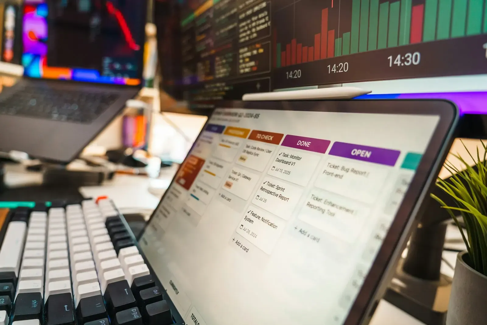 Tablet on a desk showing a project board with colored task cards